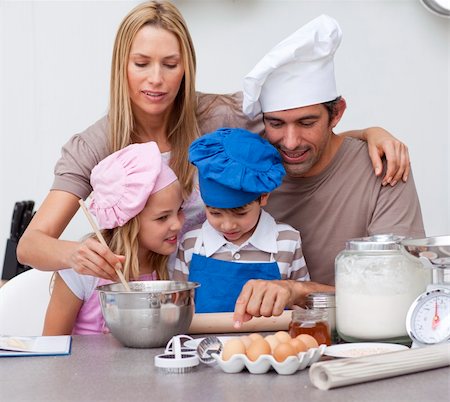 fun with flour - Children baking cookies with their parents in the kitchen Stock Photo - Budget Royalty-Free & Subscription, Code: 400-04152382