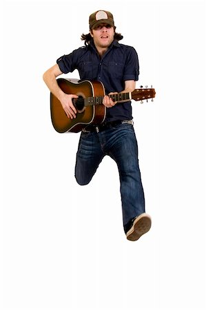 simsearch:400-04863651,k - passionate guitarist playing an acoustic guitar jumps over white Stock Photo - Budget Royalty-Free & Subscription, Code: 400-04165968