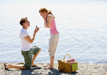 Boyfriend proposing to girlfriend near stream Stock Photo - Budget Royalty-Free & Subscription, Code: 400-04167785