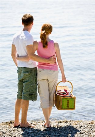 Couple having picnic near stream Stock Photo - Budget Royalty-Free & Subscription, Code: 400-04167780