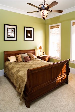 simsearch:845-05838374,k - Sleigh bed in a green bedroom with a ceiling fan and wall art. Vertical shot. Stock Photo - Budget Royalty-Free & Subscription, Code: 400-04167919