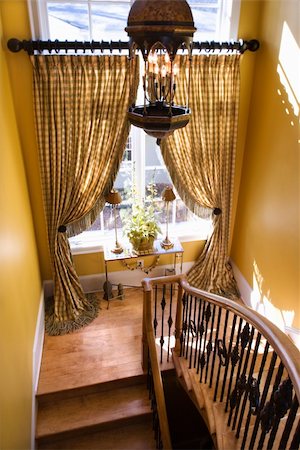 simsearch:700-06038236,k - High angle view of stair landing with curtained window and ornate banister. Vertical shot. Stock Photo - Budget Royalty-Free & Subscription, Code: 400-04167921