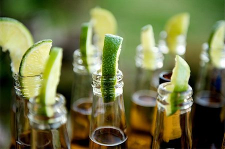 Close up image of multiple beer bottles with limes inserted Stock Photo - Budget Royalty-Free & Subscription, Code: 400-04162295