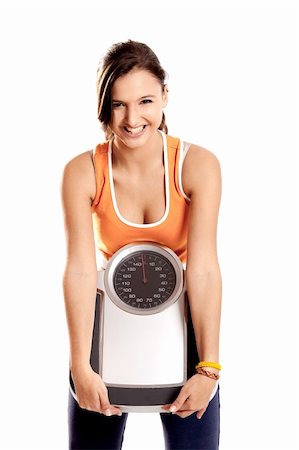 simsearch:400-04180657,k - Portrait of a beautiful athletic girl holding a scale, isolated on white Stock Photo - Budget Royalty-Free & Subscription, Code: 400-04178675