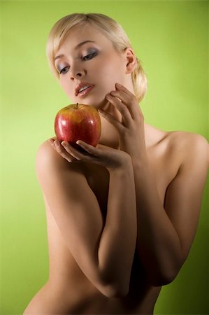 simsearch:400-04836564,k - fashion and glamour shot of a dreaming nude young woman with red apple on green background Stock Photo - Budget Royalty-Free & Subscription, Code: 400-04179746