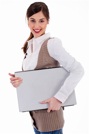 simsearch:400-04158321,k - Cute model carrying a laptop with her on a white isolated background Stock Photo - Budget Royalty-Free & Subscription, Code: 400-04171453