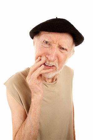 Confused senior man with hand to face wearing a beret Stock Photo - Budget Royalty-Free & Subscription, Code: 400-04172713