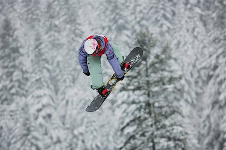simsearch:400-03985663,k - young boys jumping in air ind showing trick with snowboard at winter season Stock Photo - Budget Royalty-Free & Subscription, Code: 400-04172841