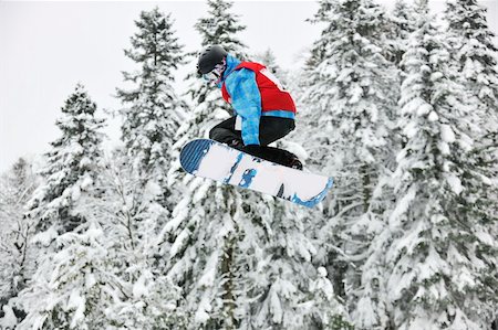 simsearch:400-03985663,k - young boys jumping in air ind showing trick with snowboard at winter season Stock Photo - Budget Royalty-Free & Subscription, Code: 400-04172843