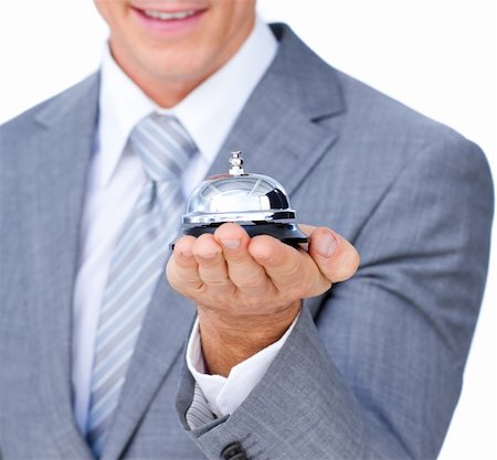Young attractive waiter holding a hotel bell Stock Photo - Budget Royalty-Free & Subscription, Code: 400-04184015