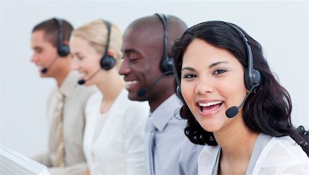 A diverse business team talking on headset in a call center Stock Photo - Budget Royalty-Free & Subscription, Code: 400-04184055