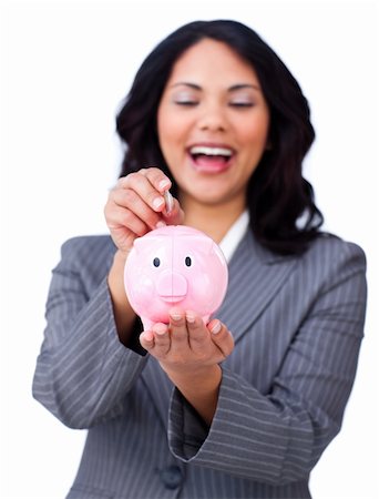 simsearch:400-04184165,k - Laughing businesswoman saving money in a piggybank isolated on a white background Stock Photo - Budget Royalty-Free & Subscription, Code: 400-04184198