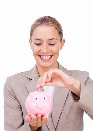 simsearch:400-04184165,k - Charming businesswoman saving money in a piggybank isolated on a white background Stock Photo - Budget Royalty-Free & Subscription, Code: 400-04184280
