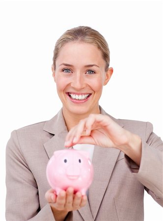 simsearch:400-04184165,k - Assertive businesswoman saving money in a piggybank isolated on a white background Stock Photo - Budget Royalty-Free & Subscription, Code: 400-04184281