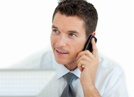 simsearch:400-05145011,k - Businessman on phone working at a computer isolated on a white background Stock Photo - Budget Royalty-Free & Subscription, Code: 400-04184817