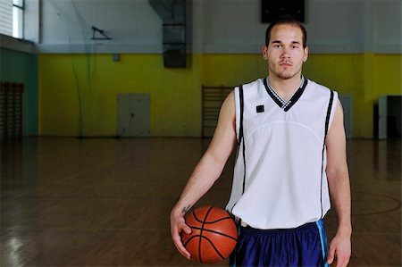 one healthy young  man play basketball game in school gym indoor relax Stock Photo - Budget Royalty-Free & Subscription, Code: 400-04185298