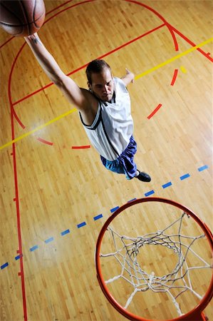 young healthy man play basketball game indoor in gym Stock Photo - Budget Royalty-Free & Subscription, Code: 400-04185323