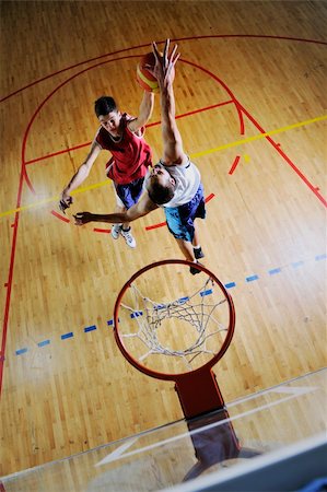 competition cencept with people who playing and exercise  basketball sport  in school gym Stock Photo - Budget Royalty-Free & Subscription, Code: 400-04185331