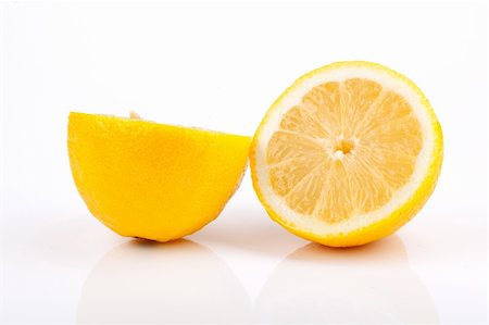 simsearch:400-04716078,k - Lemon sliced in half on white background Stock Photo - Budget Royalty-Free & Subscription, Code: 400-04185372