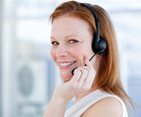 simsearch:400-05287143,k - Smiling sales representative woman with an headset against white background Stock Photo - Budget Royalty-Free & Subscription, Code: 400-04185746