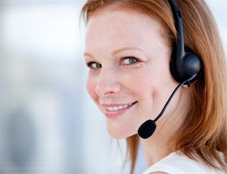 simsearch:400-05287143,k - Cute sales representative woman with an headset against white background Stock Photo - Budget Royalty-Free & Subscription, Code: 400-04185743