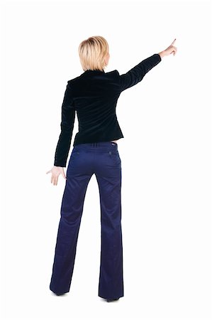 simsearch:400-04586134,k - Young woman points at wall. The rear view . Stock Photo - Budget Royalty-Free & Subscription, Code: 400-04186847