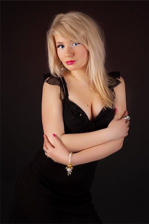 simsearch:400-04130120,k - Young beautiful blonde. Black Background.  Young beautiful blonde. Black Background. Stock Photo - Budget Royalty-Free & Subscription, Code: 400-04186870