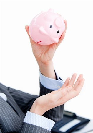 simsearch:400-04184165,k - Close-up of a businesswoman holding a piggy-bank in the office Stock Photo - Budget Royalty-Free & Subscription, Code: 400-04186970