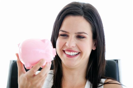 simsearch:400-04184165,k - Laughing businesswoman holding a piggybank in the office Stock Photo - Budget Royalty-Free & Subscription, Code: 400-04187034