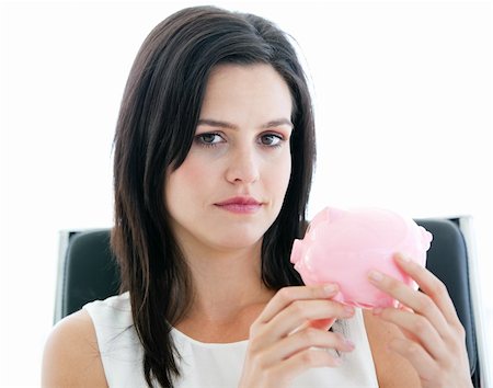 simsearch:400-04184165,k - Beautiful businesswoman holding a piggybank  and looking at the camera in the office Stock Photo - Budget Royalty-Free & Subscription, Code: 400-04187042