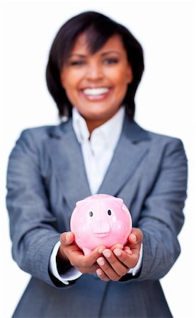 simsearch:400-05715208,k - Hispanic Businesswoman holding a piggybank against a white background Stock Photo - Budget Royalty-Free & Subscription, Code: 400-04187305