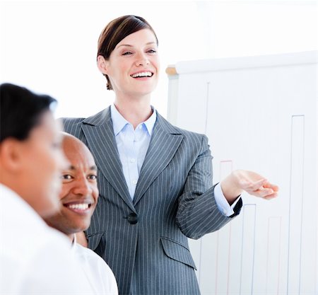 simsearch:400-05710382,k - Portrait of a confident businesswoman in a meeting in the office Photographie de stock - Aubaine LD & Abonnement, Code: 400-04187807