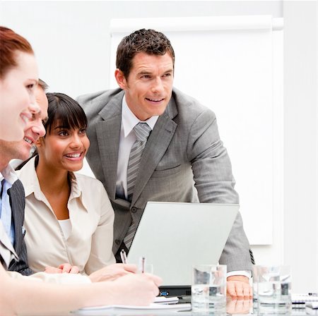 simsearch:400-05710382,k - Portrait of anice businesswoman working with her colleagues in the office Photographie de stock - Aubaine LD & Abonnement, Code: 400-04187802