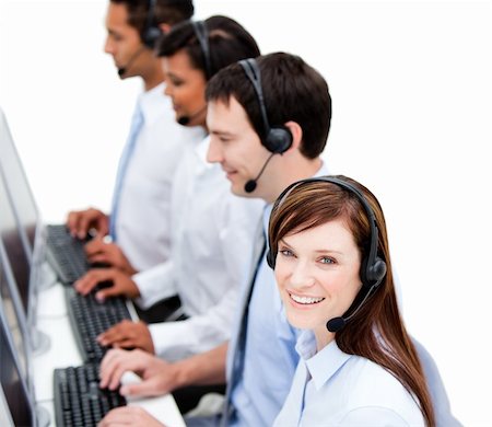 simsearch:400-05287143,k - Concentrated business team with headset on  against white background Stock Photo - Budget Royalty-Free & Subscription, Code: 400-04187818