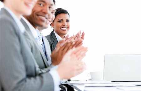 simsearch:400-05710386,k - Close up of a multi-ethnic business team applauding a presentation in the office Stock Photo - Budget Royalty-Free & Subscription, Code: 400-04187835