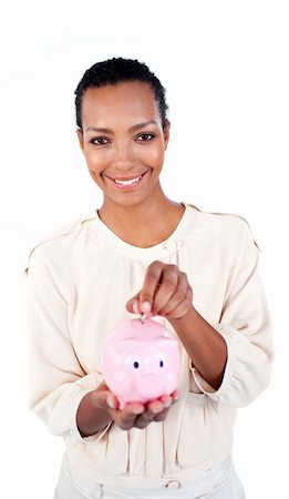 simsearch:400-04184165,k - Charming businesswoman saving money in a piggybank against a white background Stock Photo - Budget Royalty-Free & Subscription, Code: 400-04188275