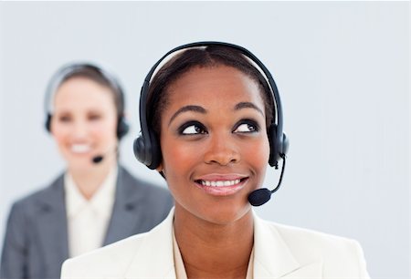 simsearch:400-05287143,k - Charismatic businesswoman and her colleague with headset in a call center Stock Photo - Budget Royalty-Free & Subscription, Code: 400-04188595