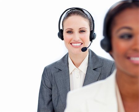 simsearch:400-05287143,k - Portrait of young businesswoman and her colleague with headset on against a white background Stock Photo - Budget Royalty-Free & Subscription, Code: 400-04188596