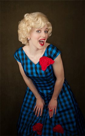 Pretty retro blonde woman in vintage 50s dress Stock Photo - Budget Royalty-Free & Subscription, Code: 400-04188851