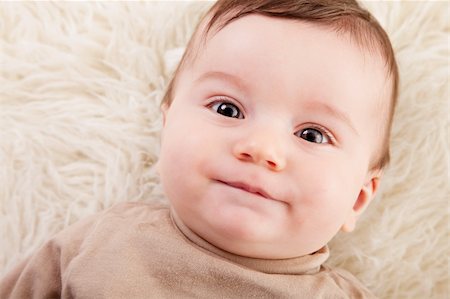 simsearch:400-04594888,k - Portrait of an adorable 6 months old baby boy staring at the camera on a fluffy background.studio shot. Stock Photo - Budget Royalty-Free & Subscription, Code: 400-04181012