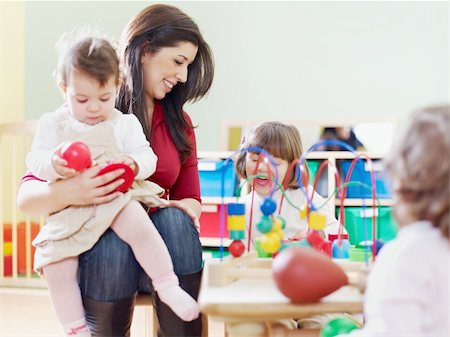 female toddler and 2-3 years girls playing with toys in kindergarten. Horizontal shape, copy space Foto de stock - Super Valor sin royalties y Suscripción, Código: 400-04181554