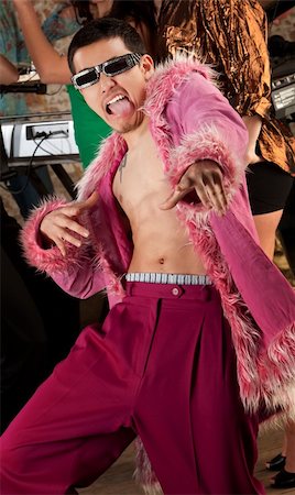 simsearch:400-04206686,k - Young Asian man in pink fuzzy robe dancing Stock Photo - Budget Royalty-Free & Subscription, Code: 400-04181703