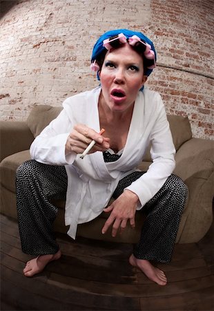 simsearch:400-04206686,k - Befuddled woman with pink hair curlers and white bathrobe Stock Photo - Budget Royalty-Free & Subscription, Code: 400-04182348