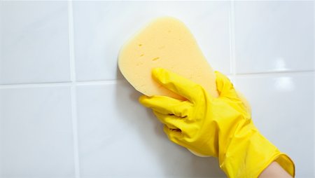simsearch:400-04287497,k - Close-up of a woman cleaning a bathroom with a sponge Stock Photo - Budget Royalty-Free & Subscription, Code: 400-04182660