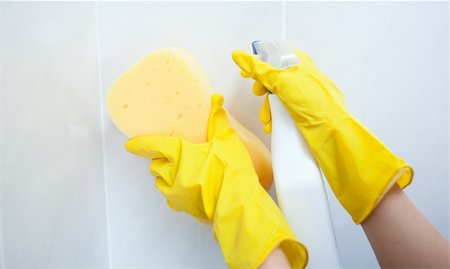 simsearch:400-04287497,k - Close-up of a woman cleaning a bathroom with a sponge and detergent spray Stock Photo - Budget Royalty-Free & Subscription, Code: 400-04182675