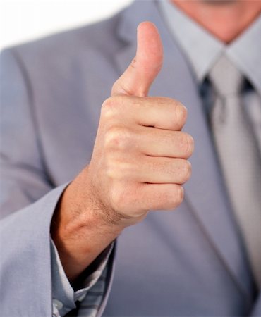 simsearch:400-04875087,k - Close-up of a businessman with thumb up against a white background Photographie de stock - Aubaine LD & Abonnement, Code: 400-04183095