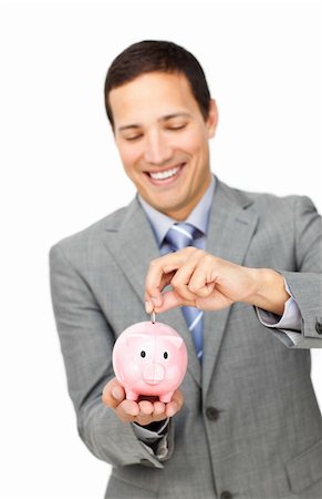 simsearch:400-04184165,k - Young businessman saving money in a piggy-bank against a white background Stock Photo - Budget Royalty-Free & Subscription, Code: 400-04183123