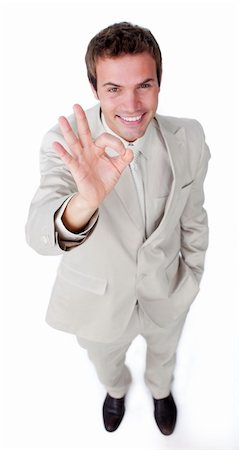 simsearch:400-04875087,k - Assertive businessman showing OK sign isolated on a white background Photographie de stock - Aubaine LD & Abonnement, Code: 400-04183746