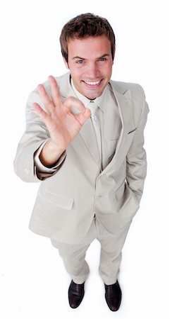 simsearch:400-04875087,k - Fortunate businessman showing OK sign isolated on a white background Photographie de stock - Aubaine LD & Abonnement, Code: 400-04183747