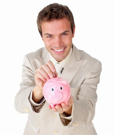 simsearch:400-04184165,k - Smiling young businessman saving money in a piggy-bank against a white background Stock Photo - Budget Royalty-Free & Subscription, Code: 400-04183804